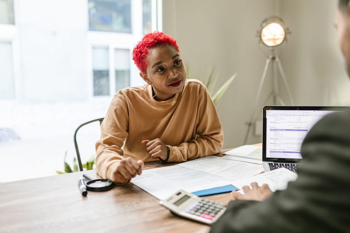 A business owner reviewing corporate tax paperwork